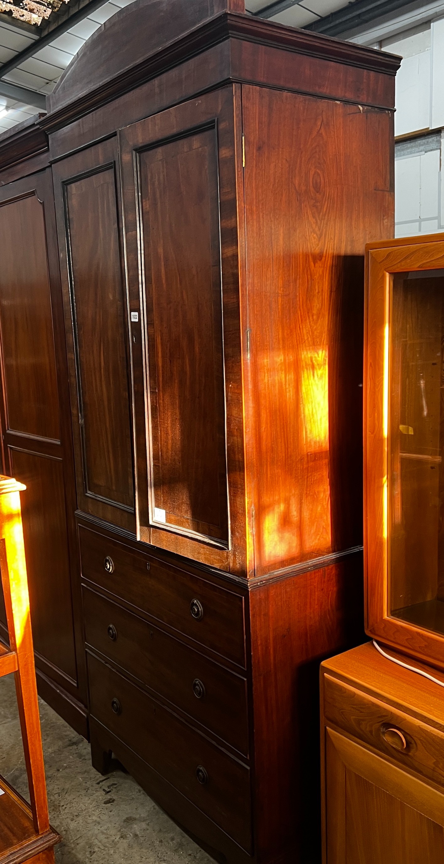 An early 20th century Regency style narrow mahogany linen press, width 92cm, depth 54cm, height 220cm